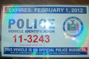 A police placard. Placards are routinely abused by NYPD officers, who use them to park their personal vehicles illegally near their jobs at precints.