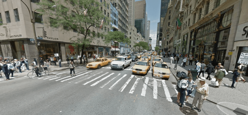 Fifth Avenue at 48th Street: Lots of space for cars, cramped conditions on the margins for people walking and biking. Photo: Google Maps