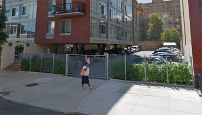 Mandatory parking minimums raise construction costs, restrict the supply of housing, and help put rents out of reach. Photo: Google Street View