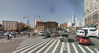 People contend with long crosswalks and tides of turning vehicles at Times Plaza in Brooklyn. Image: Google Maps