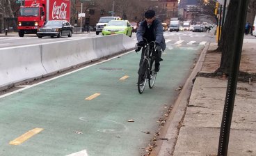 This two-way bike lane separates cyclists from high-speed motor vehicle traffic on First Avenue. Photos: David Meyer