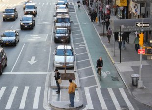 New York City has replaced a lot of parking spaces with pedestrian islands that save lives. More please. Photo: NYC DOT