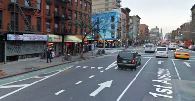Cyclists on First Avenue negotiate this "mixing zone" at 9th Street at the same time as left-turning motorists. Google Maps