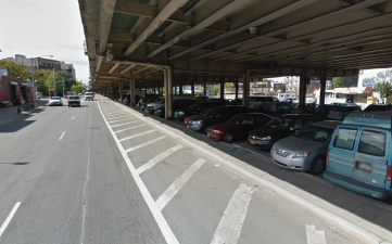 DOT is considering repurposing the giant "parking fields" on Meeker Avenue under the BQE for biking and walking. Photo: Google Maps