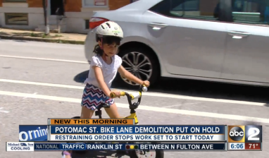 A judge is the only thing standing between Baltimore Mayor Catherine Pugh and her mission to remove this protected bike lane. Image: WMAR-TV