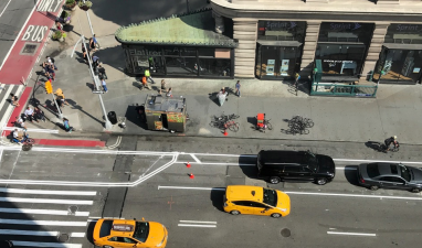 At 23rd Street, the Fifth Avenue bike lane is now protected from moving traffic by parked cars. Photo: Justin Pollock