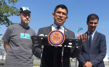 Council Member Carlos Menchaca with StreetsPAC Executive Director Eric McClure and Council Member Ydanis Rodriguez this morning. Photo: David Meyer