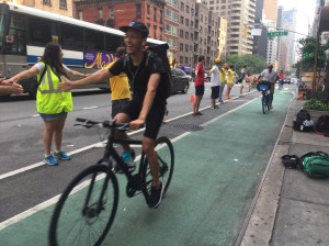 Volunteers formed a "human-protected bike lane" on Second Avenue this morning. Photo: David Meyer