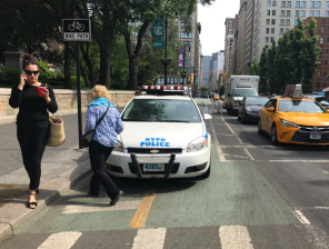 Cyclists want more protected bike lanes — and it's not protected if someone can park on it. Photo: Paco Abraham