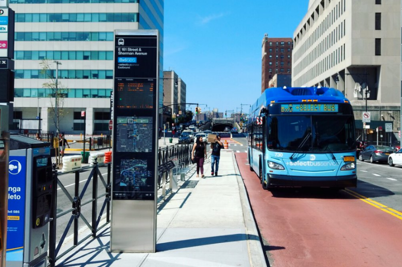 A new center-running bus lane and median island bus stop at East 161st Street and Sherman Avenue. Photo: TransitCenter