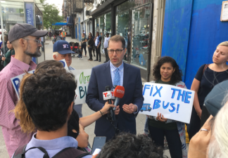 Council Member Mark Levine and members of the Bus Turnaround Coalition at a Bx19 stop in Upper Manhattan. Photo: Brad Aaron