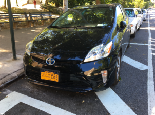 A city-owned vehicle blocking sight lines at a crosswalk in Inwood in 2017. Photo: Brad Aaron