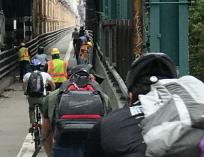 People biking, walking, and working must all compete for the same narrow space on the Queensboro Bridge. Photo: Twitter/Laura Newman
