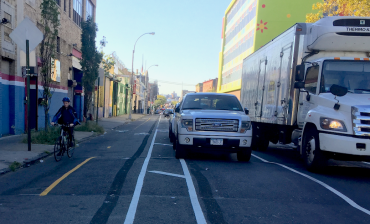 The new protected bike lane taking shape on 133rd Street east of St. Ann's Avenue. Photo: David Meyer