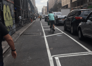 The new protected bike lane on Seventh Avenue between 29th Street and 28th Street. Photo: Christa Orth