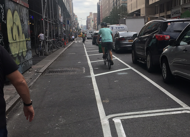 The new protected bike lane on Seventh Avenue between 29th Street and 28th Street. Photo: Christa Orth