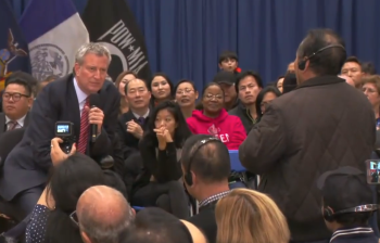 Mayor de Blasio listens as Jinhua Li asks about the city's upcoming crackdown on electric bicycles. ViaNYC Mayor's Office/YouTube