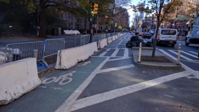 These bike lane-cluttering barricades come courtesy of the NYPD.