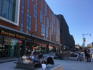 This plaza on Myrtle Avenue took ten years to become a reality, but it was an immediate hit. "As soon as there were seats, people were sitting in them," said BID director Meredith Phillips Almeida. Photo: Myrtle Avenue Revitalization Project