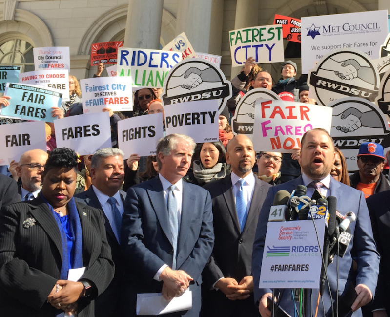 L-R: Bronx DA Darcel Clark, Brooklyn DA Eric Gonzalez, Manhattan DA Cy Vance, Bronx Borough President Ruben Diaz Jr., and City Council Speaker Corey Johnson, at podium, at today's Fair Fares rally. Photo: David Meyer