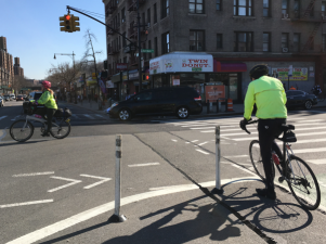 Bowing to pressure from business people and Congressman Adriano Espaillat, Council Member Ydanis Rodriguez wants DOT to redo protected bike lanes on Dyckman Street, weeks after they were installed. Photo: Brad Aaron