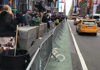 NYPD barricades are back in Times Square's raised bike lane. Photo: Brian Van Nieuwenhoven/Twitter