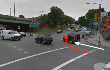 A box truck driver fatally struck a man on a bike where Webster Avenue intersects with the Cross Bronx Expressway. The white arrow indicates the direction the victim was traveling and the red arrow shows the approximate path of the driver. Image: Google Maps