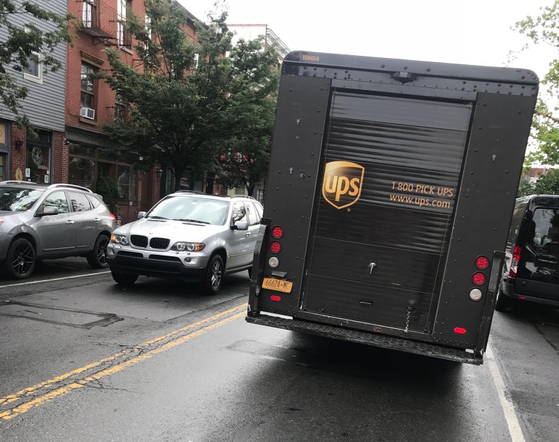 Double-parked trucks are an everyday annoyance on our residential streets, thanks to a city program that reduces fines for illegal parking. Photo: Gersh Kuntzman