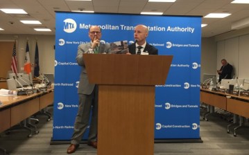 New York City Transit President Andy Byford holds up a copy of his $37 billion "Fast Forward" plan to fix the subways and buses. Photo: David Meyer
