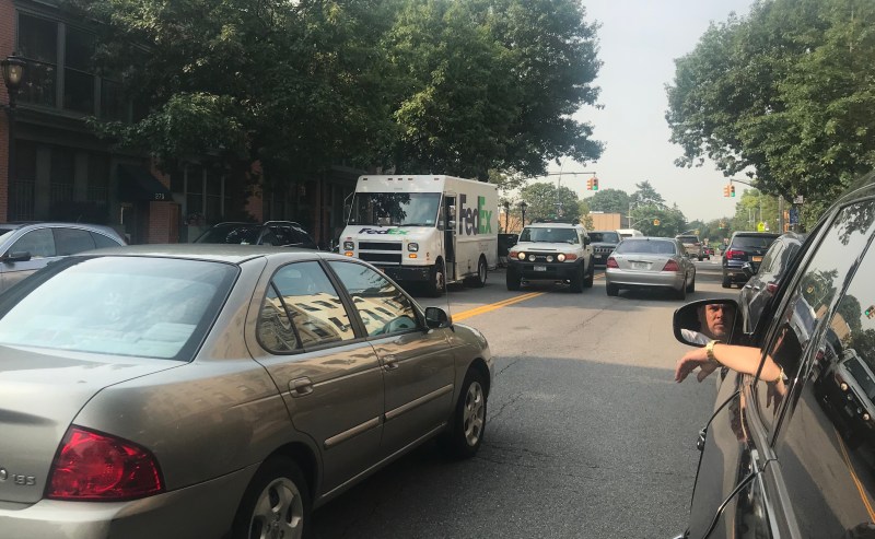 This FedEx driver could have been slapped with a $115 ticket for double parking. But the summons would be reduced to $0 under the Stipulated Fine Program. Photo: Gersh Kuntzman
