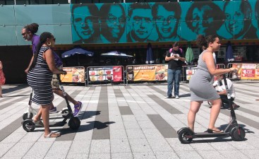 It was kind of weird to see all these people scooting around on Bird devices on Wednesday in front of a mural of American heroes such as Robert F. Kennedy. Photo: Gersh Kuntzman