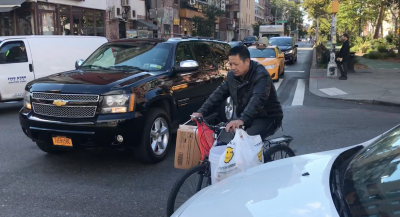 This bicyclist was forced into traffic because of an unsafe new design installed this week by DOT. Photos: Gersh Kuntzman