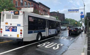 A blocked bus lane on Fulton Street in Brooklyn. (Full disclosure: this is file art.) Photo: Ben Fried