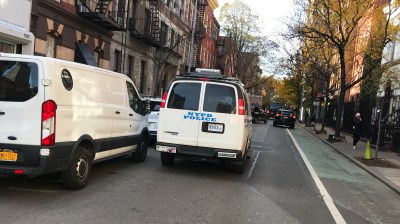 One of the illegally parked cars was, of course, a police van, which created this chokepoint on Christopher Street. Photo: Gersh Kuntzman