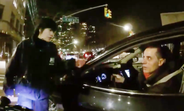 Officer So confronts the cabbie. Photo: Bike Commuting NYC