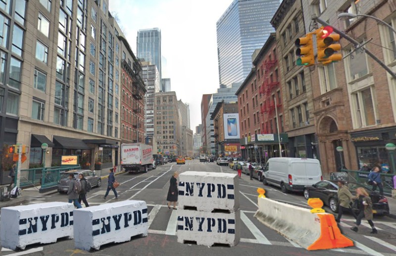 The NYPD has erected temporary barricades on West Broadway to prevent southbound drivers from entering the new car-free zone. Photo: Gersh Kuntzman