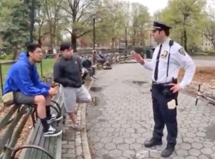 An NYPD lieutenant tells kids why some of them got tickets for not having bells. Photo: Terry Barentsen via YouTube.