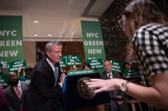 Mayor de Blasio tries to hear — then ultimately didn't really answer — a question from Streetsblog's Julianne Cuba at his presser at Trump Tower on Monday: Photo: Michael Appleton/Mayoral Photography