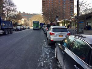 Cars frequently reclaim  protected bike lanes — as they did on the two-way stretch of Clinton Street on the Lower East Side — between the time the DOT removes pavement and when the agency restores painted markings. Photo: Jon Orcutt