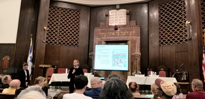 A DOT presenter desribes plans for traffic calming on Church Avenue in Kensington, Brooklyn, at Congregation Beth Shalom v'Emeth Reform Temple. Rowdy audience members disrupted the presentation. Photo: Cal ista DeJesus