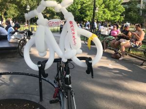 A balloon bike at the "die-in" in Washington Square Park pleads to stop the killing.