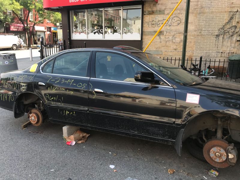 An abandoned car turned art project on Huron Street. Photo: Julianne Cuba.