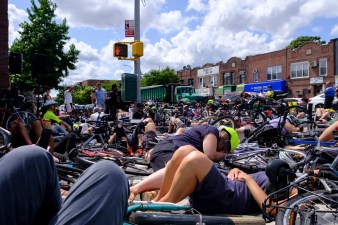 Cyclists staged a die-in at the intersection of Coney Island Avenue and Avenue L on Sunday to honor Jose Alzorriz — and demand change. Photo: Vladimir Vince
