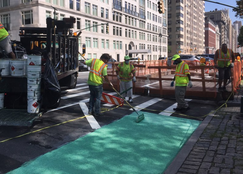 DOT finishing work on a portion of the Central Park West protected bike lane. File photo: Gersh Kuntzman