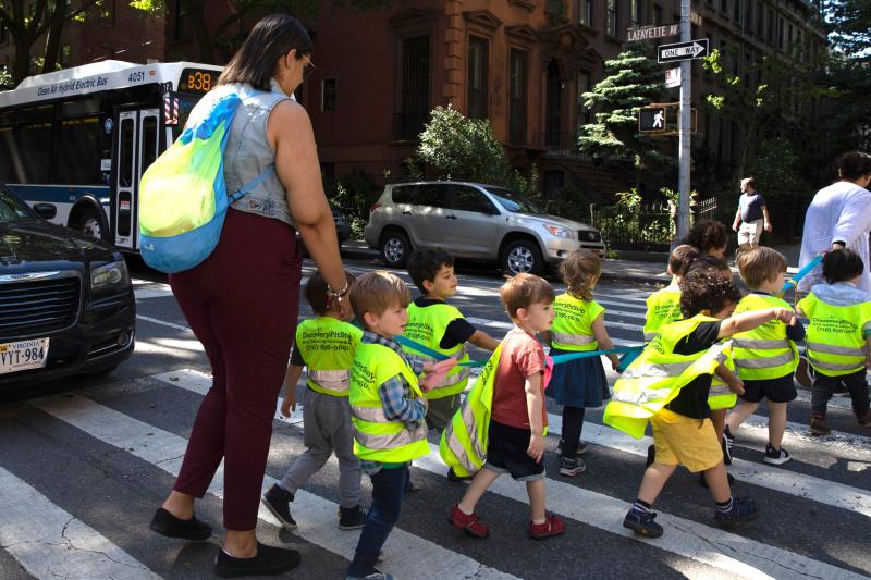 Children are escorted across Lafayette Avenue in Clinton Hill last year. Photo: Bess Adler