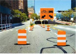 The city created a temporary protected bike lane on First Avenue during the UNGA, sending cyclists through the left side of the tunnel between 40th and 49th streets. Photo: DOT.