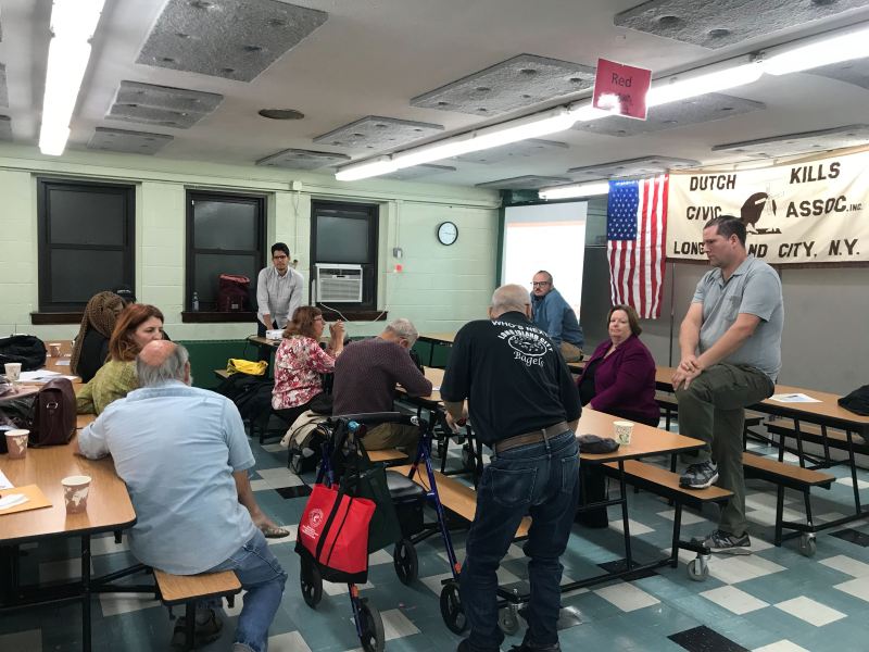 At a community meeting on Thursday, Assembly Member Cathy Nolan (seated in purple) proposed that cyclists should be banned from some local streets. Photo: Dave Colon