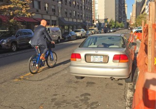 When cops park in bike lanes — or illegally — cyclists are forced into traffic. Photo: Gersh Kuntzman