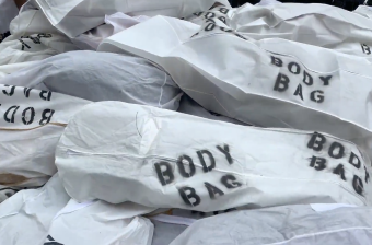 Activists laid out symbolic body bags to mark Sunday's "Day of Remembrance" for victims of road violence. Photo: Clarence Eckerson