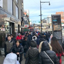Crowds on dangerous Flushing Main Street. The City Council is considering a rezoning that would add more cars to the area. Photo: Steven Vago
